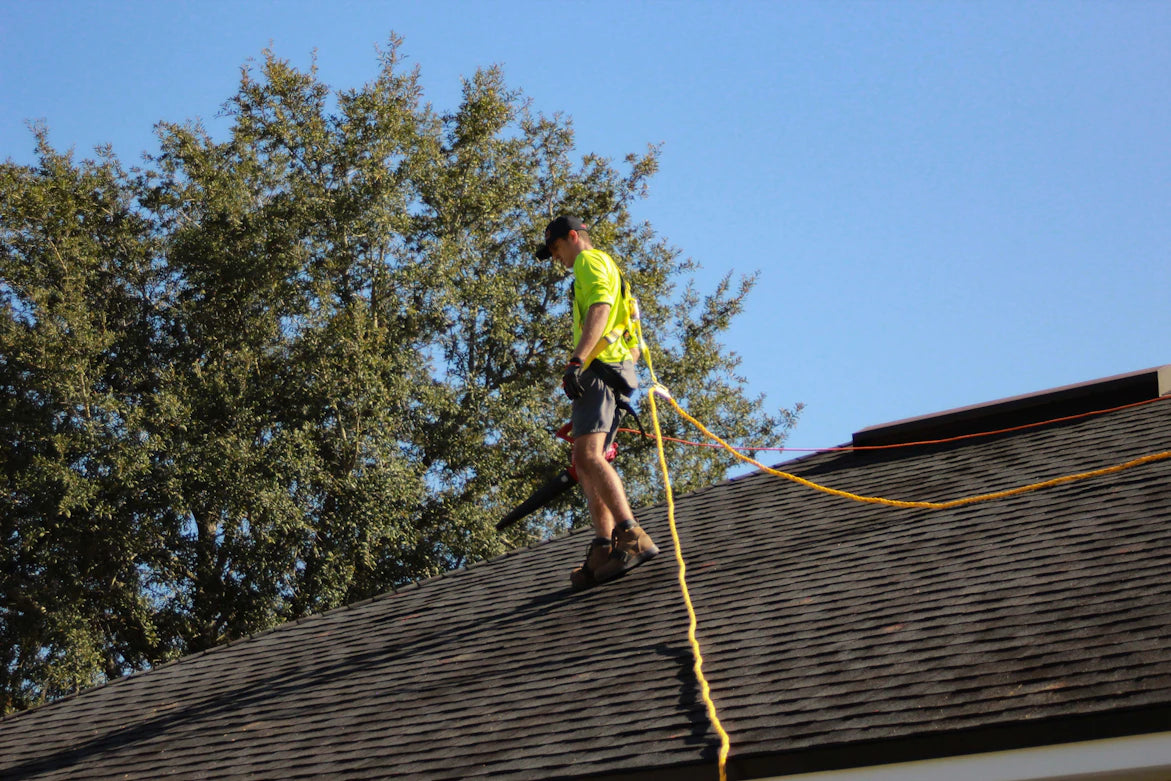 Share Restoration Employee On Roof